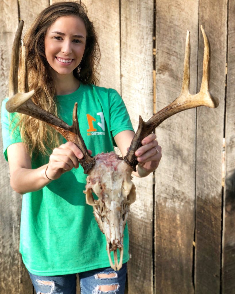 aly from Alabama holding deer skull