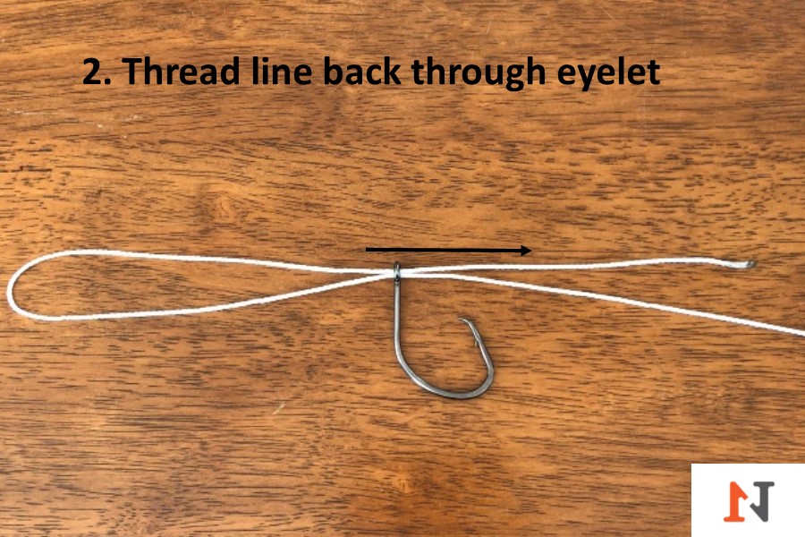 threading line back through hook eyelet for palomar knot