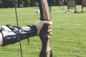 history of archery arm guard