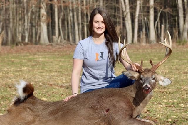 girl with muzzle loader buck