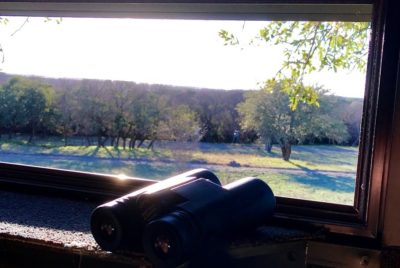 hunting blind window and binoculars