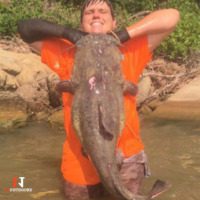 nate kennedy with noodled huge flathead catfish