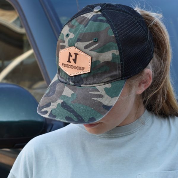 girl wearing N1 Outdoors leather patch hat in green camo