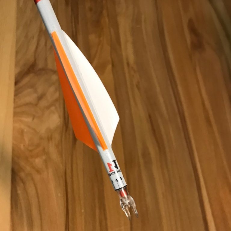 Reflective arrow wraps for nock tuning