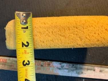 sponge and tape measure showing the concept of a broadside shot