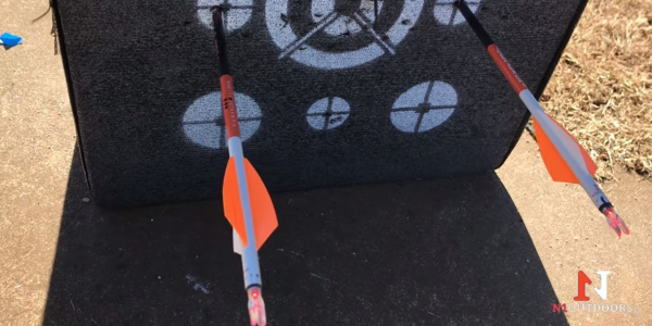 two arrows near bullseyes on foam target
