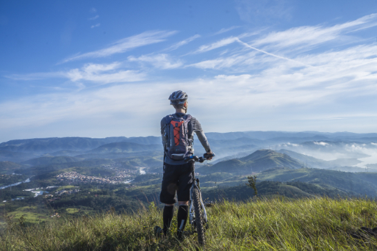 mountain biker overlooking mountain range