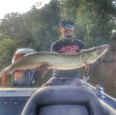 man holding a large muskie