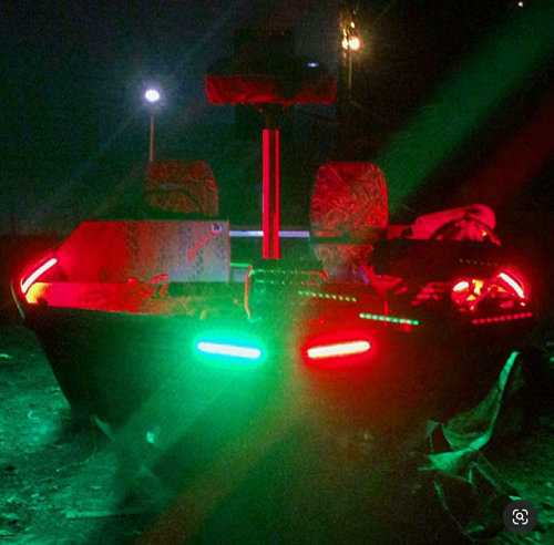 night fishing boat with red and green leds