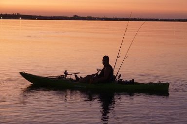 fishing from kayak at dusk