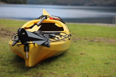 fishing kayak sitting on bank