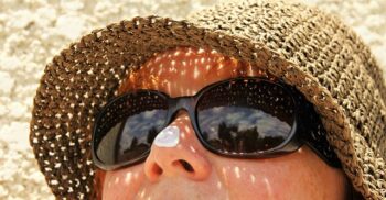 woman with sunscreen on nose