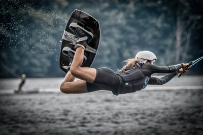 girl doing trick on wakeboard