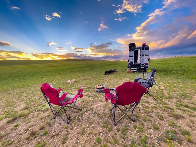 fifth wheel camping trailer in field