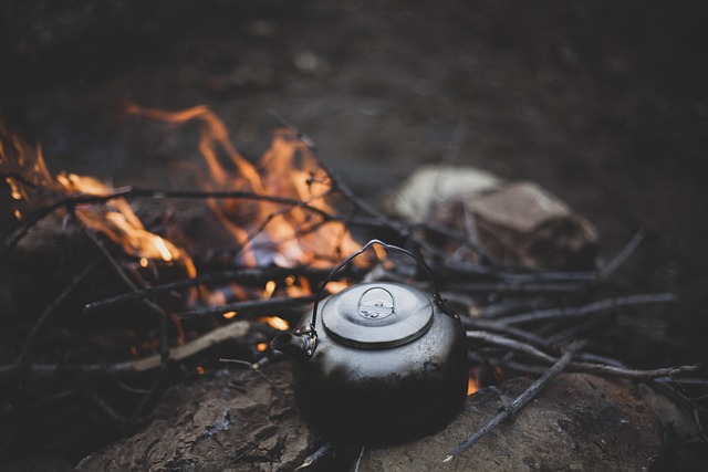 boiling water over campfire