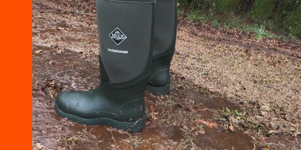 muck boots pathfinder standing in puddle