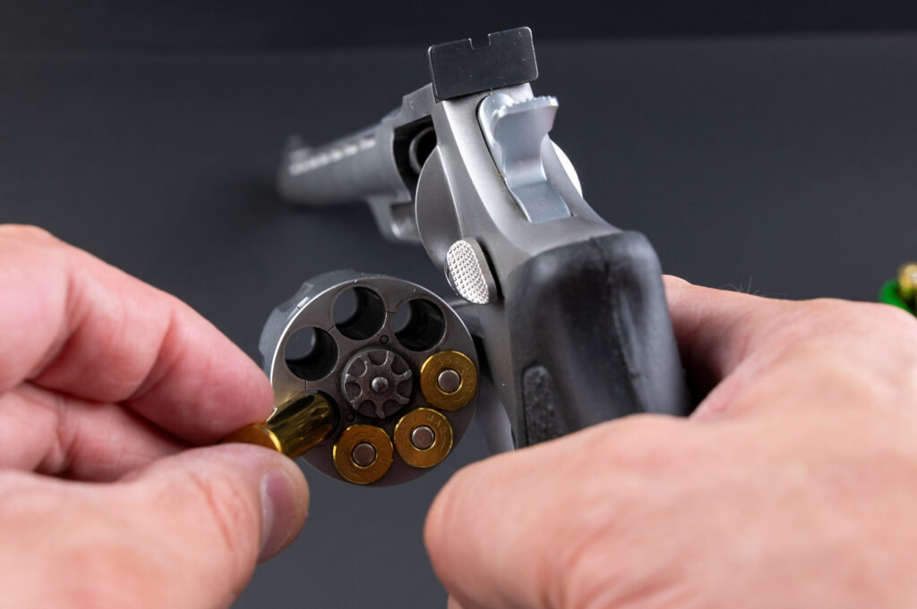 Loading .357 magnum rounds into a revolver