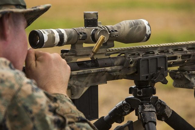 marine looking through rifle scope