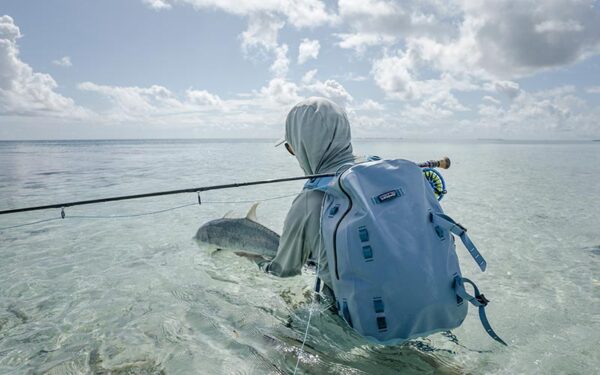 seychelles fly fishing man with fish