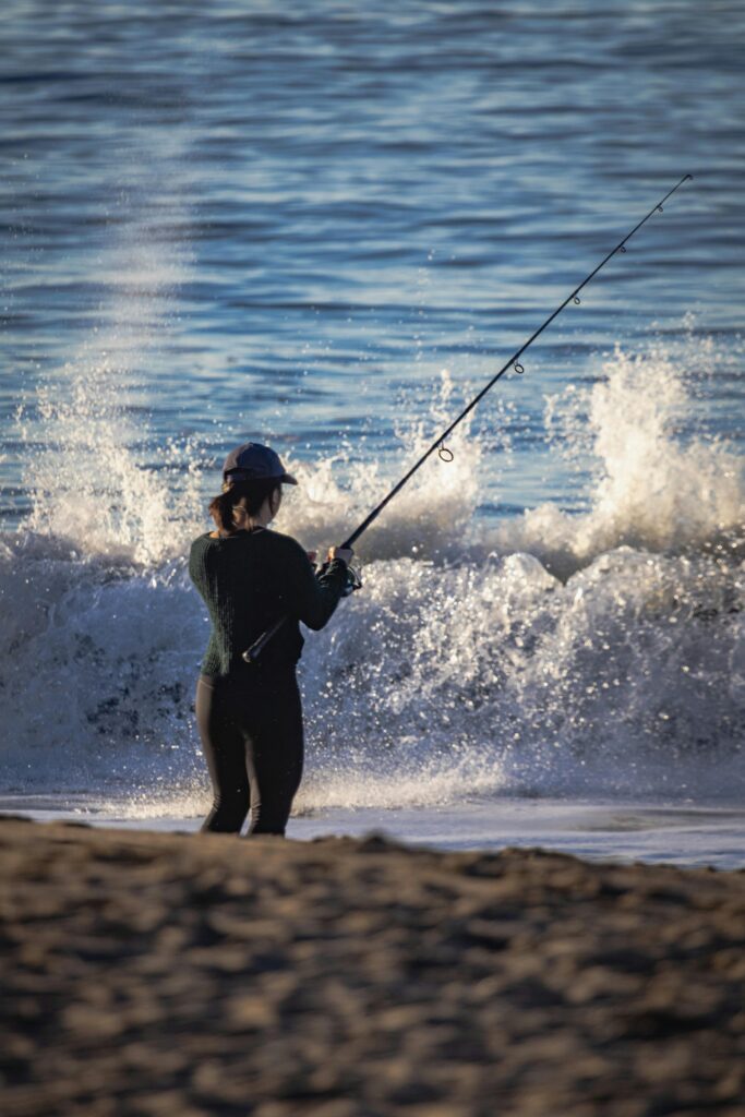 woman surf fishing in florida
