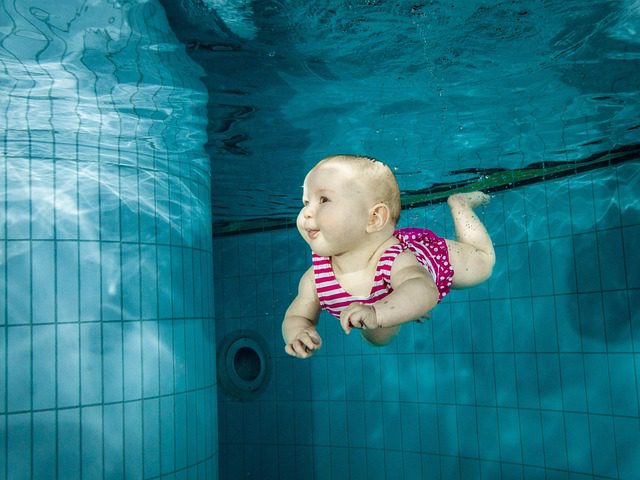 baby underwater in pool