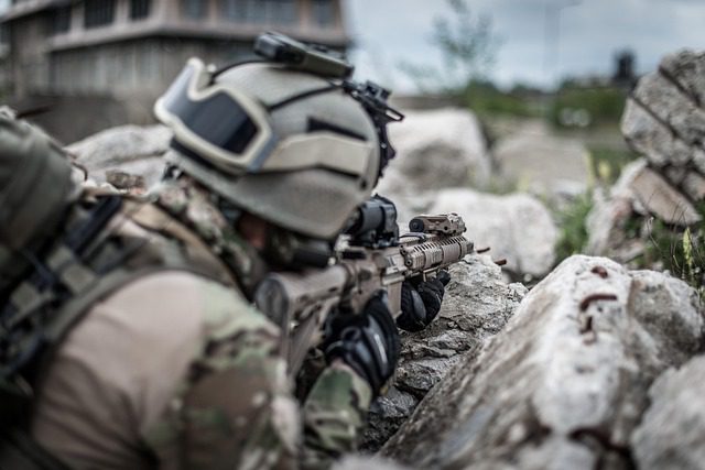 military soldier pointing military rifle