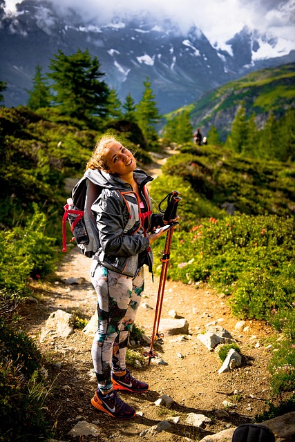 female hiker with walking sticks