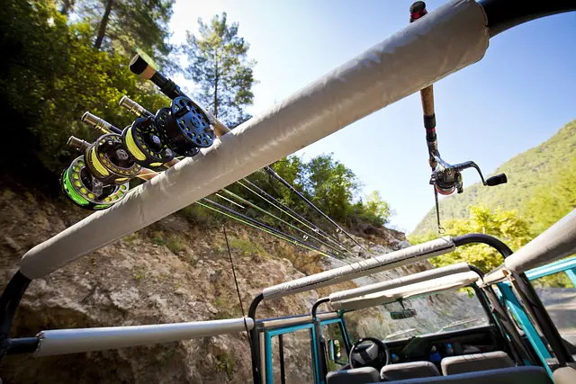 fly rods on top of jeep