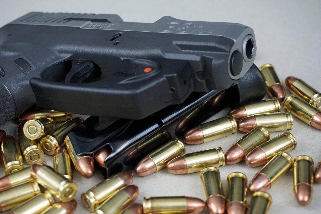 handgun with bullets on counter