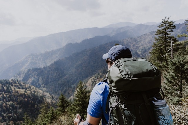 man looking at mountains on a hike