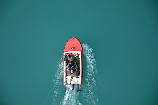 overhead view of people in a red boat