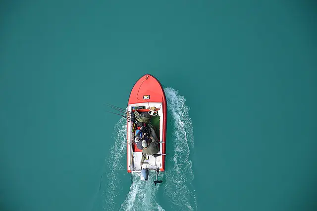 overhead view of people in a red boat
