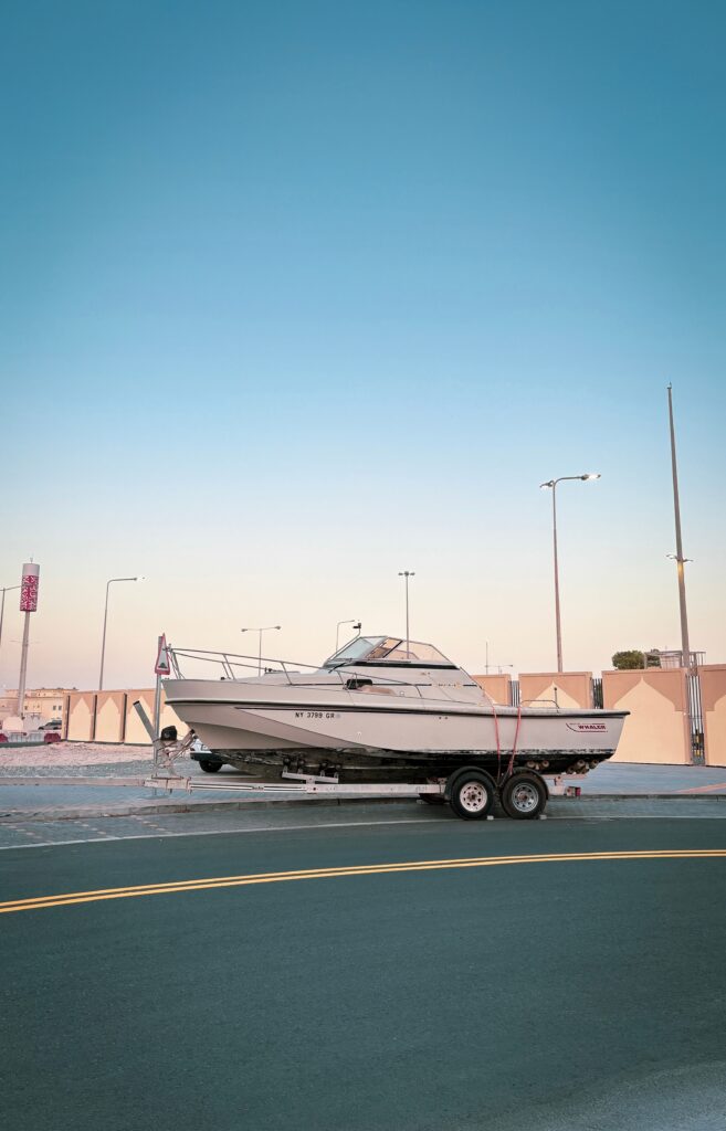 boat sitting on trailer with no truck