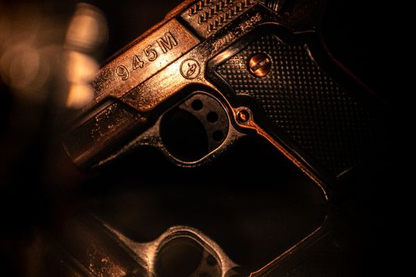 old handgun with markings