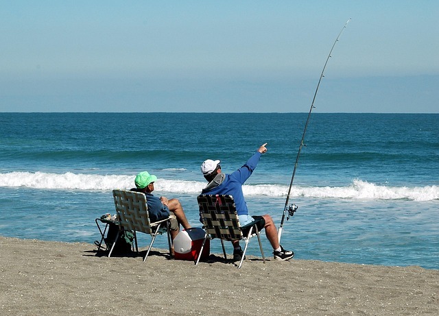 two men surf fishing